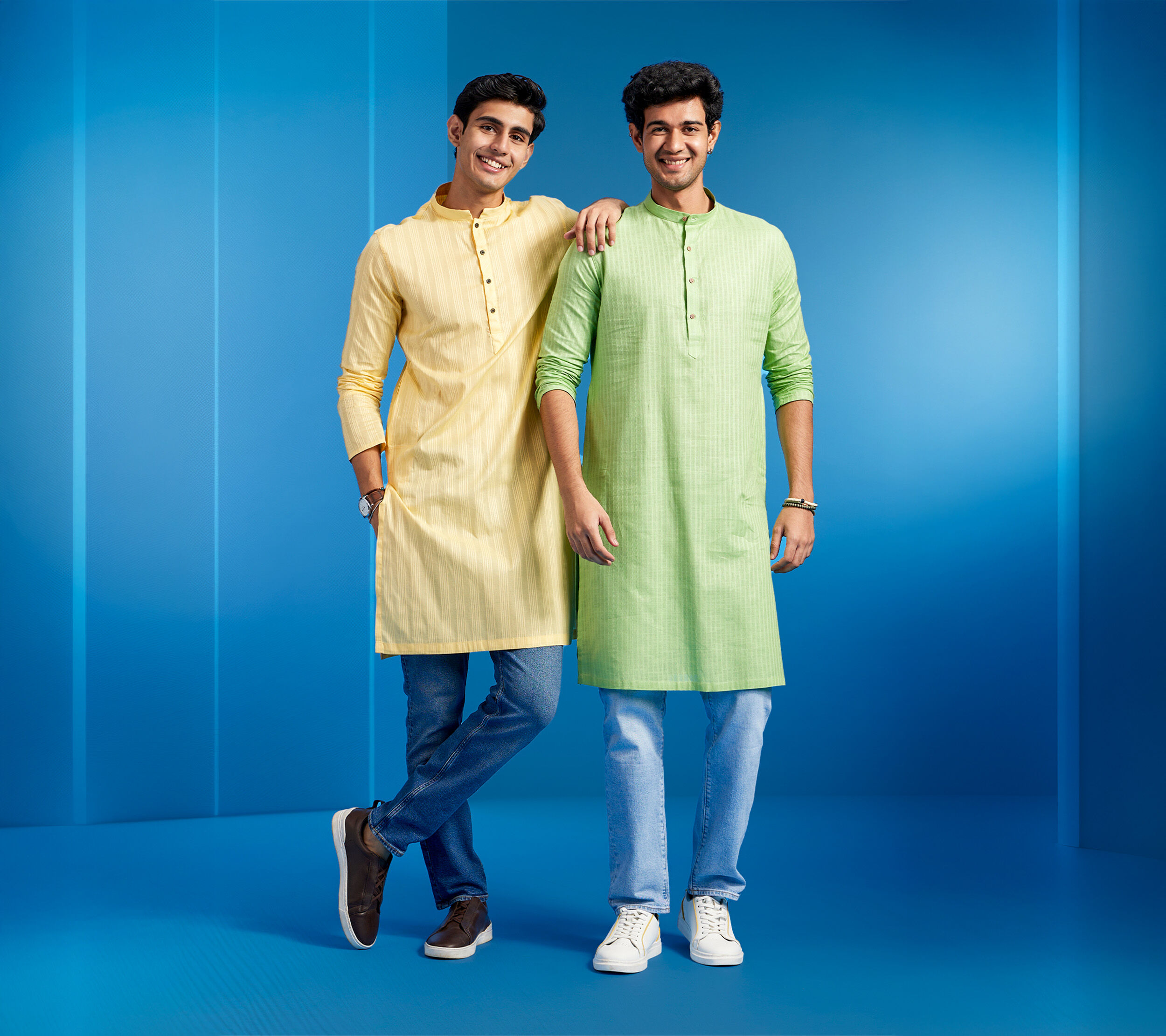 Diwas kurta with jeans styling featuring two men in modern ethnic kurtas paired with denim for casual wear.